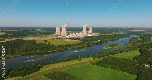Aerial view to nuclear power plant in France. Atomic power stations are very important sources of electricity with low carbon footprint. Aerial view to big source of emissions in European Union