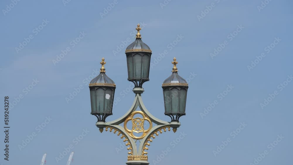 A close up view of an old metal street lamp. A close up view of an old metal street lamp.