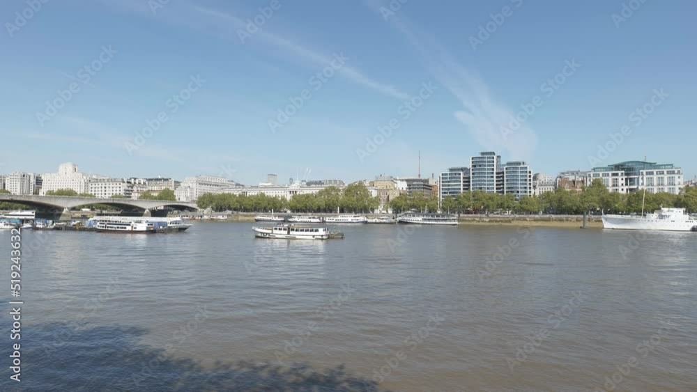 London city viewed across the Thames river on a sunny day. London city viewed across the Thames river on a sunny day.