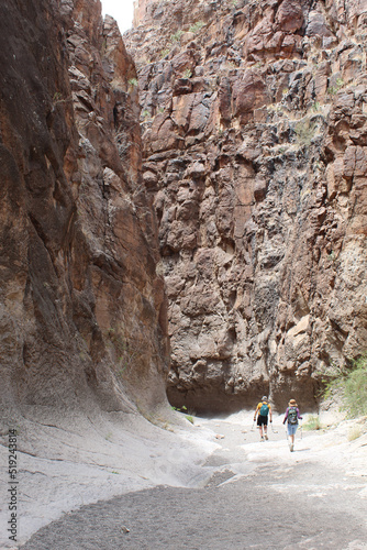 Two hikers at Closed Canyon at Big Bend Ranch State Park in Texas