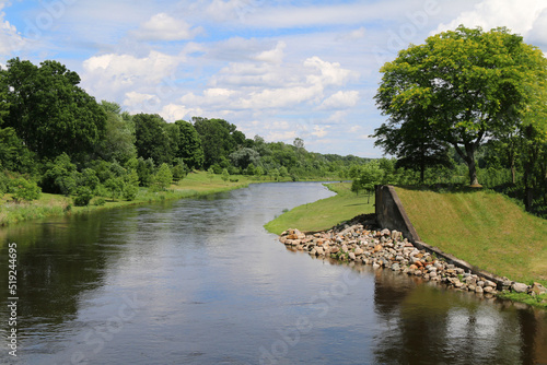 Εκτύπωση καμβά tranquil riparian river water tree lined waterway dam clouds rural landscape blu