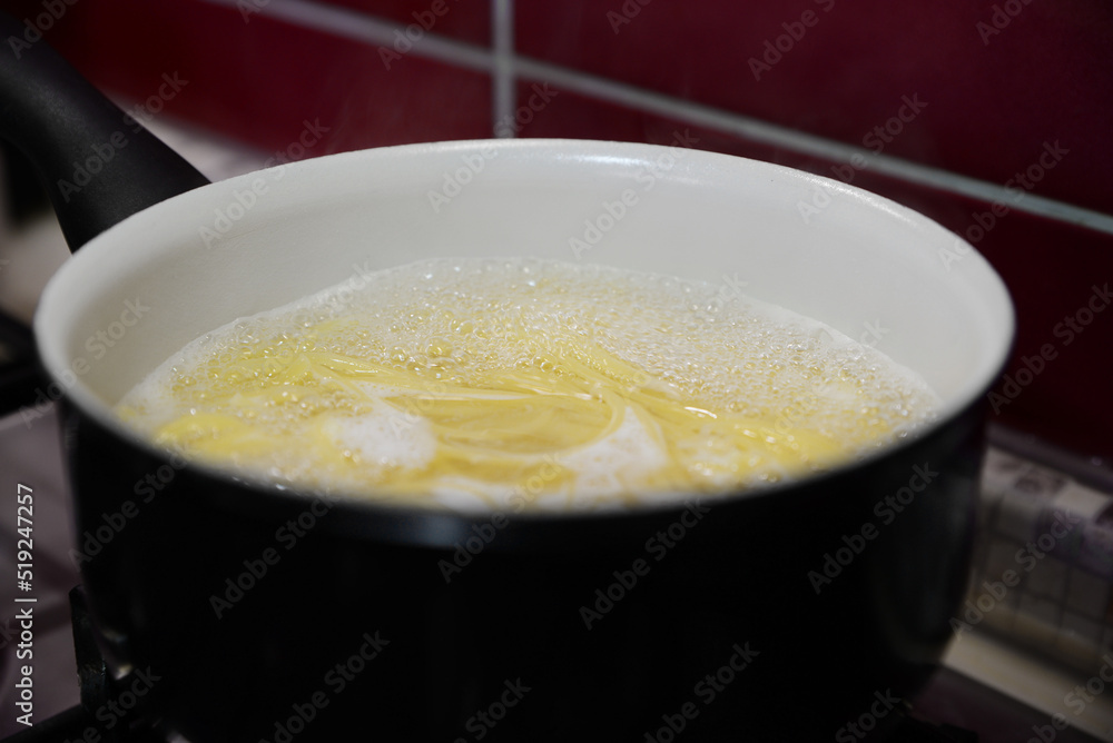 Cooking pasta in saucepan on stove, closeup Cooking pasta in saucepan on stove, closeup