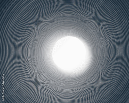 Foto inside of corrugated pipe with light at the end