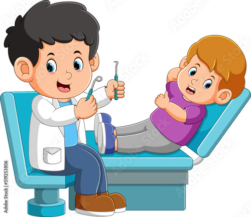 The dentist is ready to check little boy's tooth with tools in a clinic