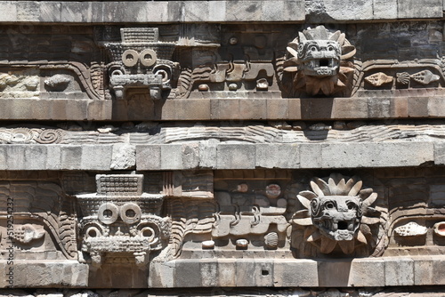 Tlaloc and Quetzalcoatl High-Relief Busts on Pyramid of the Feathered Serpent, Teotihuacan, Mexico photo