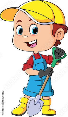 The little boy is digging the ground with the shovel