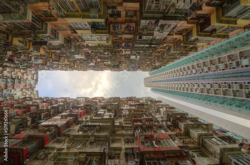 Canvas Print Low angle view of crowded residential towers in an old community in Quarry Bay,