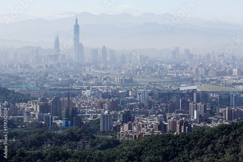 Aerial view of Taipei 101 tower in XinYi District, and Keelung River, capital city of Taiwan, with heavily polluted air on a hazy winter day ~ Air pollution level of PM2.5 classified as "Beyond Index"