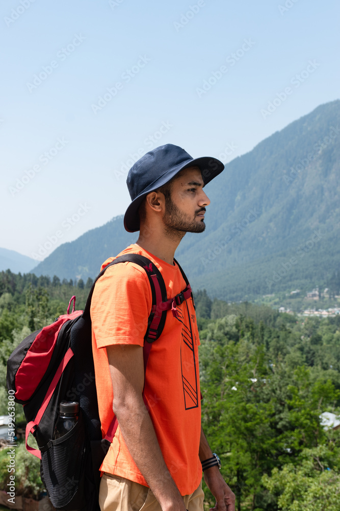 Hiker in mountains, Gulmarg, Jammu and Kashmir, India.