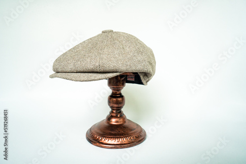 Obraz na plátně Detail of a classic eight-panel newsboy hat, in khaki herringbone tweed fabric s