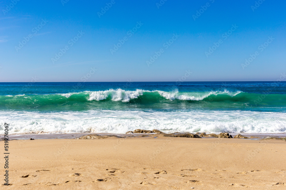 A view on Pacific ocean with blue water and waves