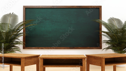 Chalkboard and desk in school classroom, 3D rendering.