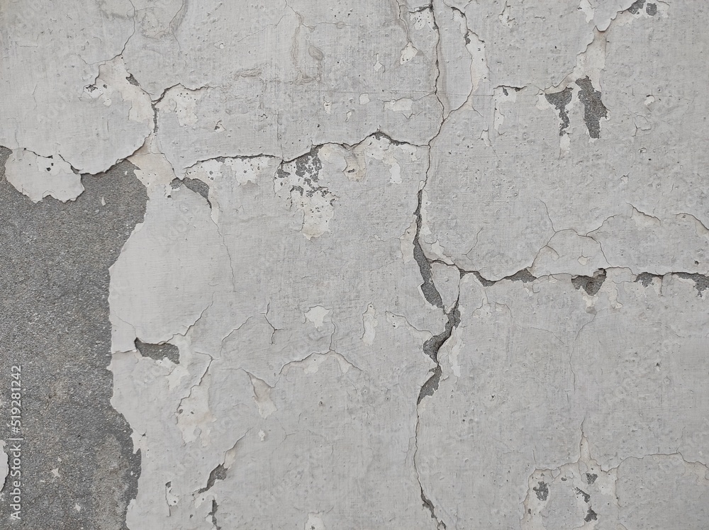 Fototapeta premium Peeling Grunge Wall Texture.Patched and Deteriorating Wall.Rusty and Dilapidated Wall Surface.Chipped and Peeling Plaster Texture.Cracked and Textured Cement Wall.Rough and Flaking Mortar Texture.