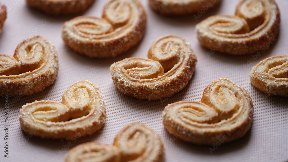 Delicious puff pastry cookies with sugar sprinkles Delicious puff pastry cookies with sugar sprinkles