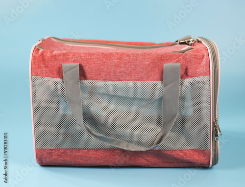 Animal transportation bag, isolated on blue background.