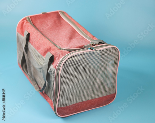 Animal transportation bag, isolated on blue background.