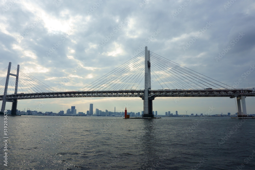 View of bridge against cloudy sky. Impressive Yokohama bay bridge over Tokyo Bay View of bridge against cloudy sky. Impressive Yokohama bay bridge over Tokyo Bay