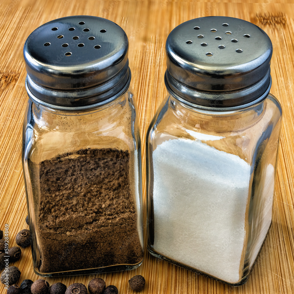 two glass containers for kitchen spices with metal lids two glass containers for kitchen spices with metal lids