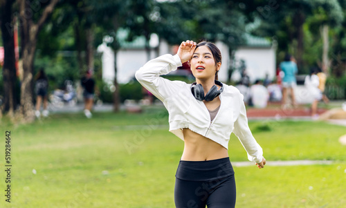 Portrait sport asian beauty body slim woman warming up in sportswear relax and do fitness exercise running and jogging in fitness training at park.Diet concept.Fitness and healthy