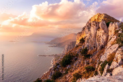 amazing panoramic view from a high rock to  sunset or sunrise sea in evening or morning with coastline © Yaroslav