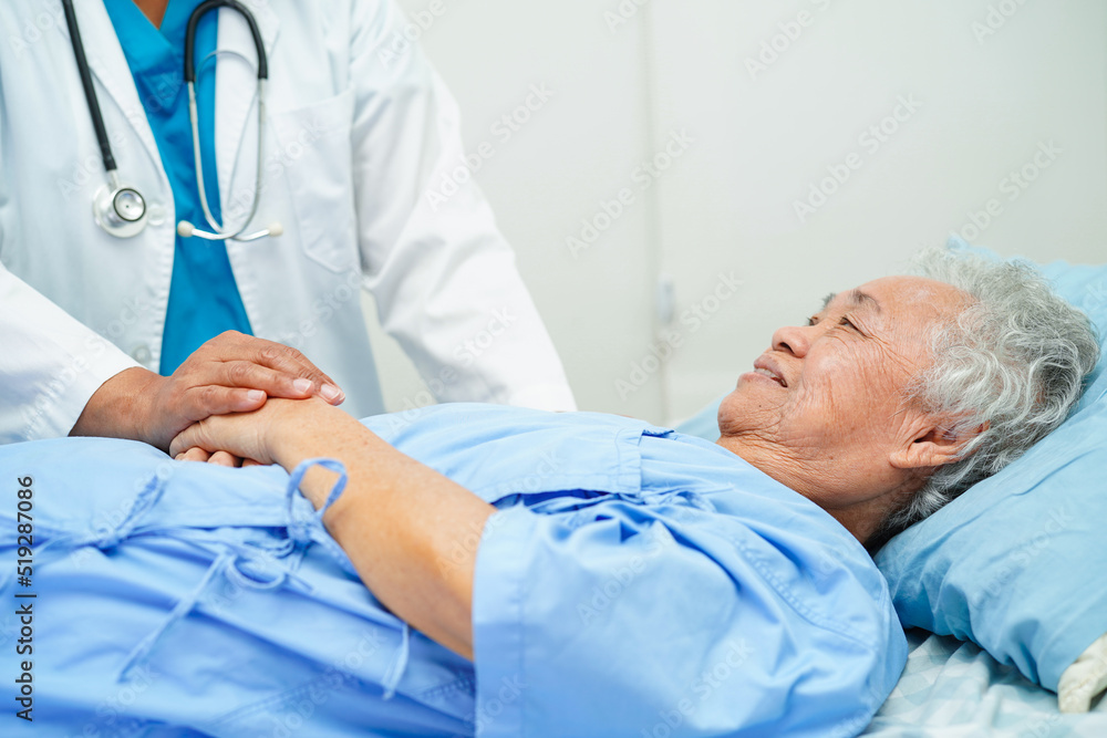 Doctor holding hands Asian elderly woman patient, help and care in hospital. Doctor holding hands Asian elderly woman patient, help and care in hospital.