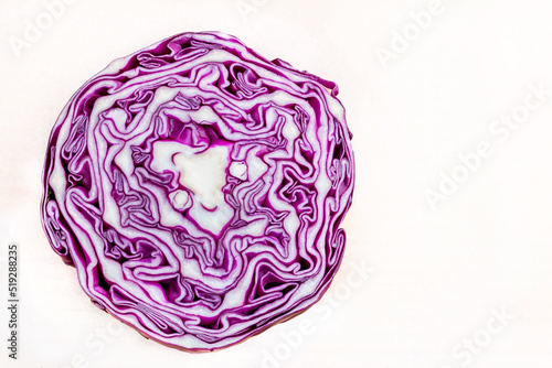 photo of sliced red cabbage from top with copy space. Close up pattern of purple color cabbage photo