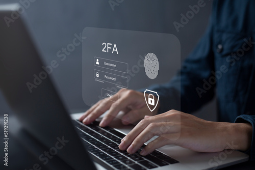 Person using laptop and touching virtual screen for two-factor authentication for safety use of social networks and access to information privacy photo