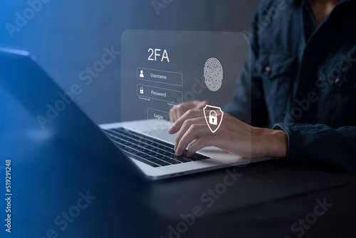 Obraz na plátně Person using laptop and touching virtual screen for two-factor authentication fo