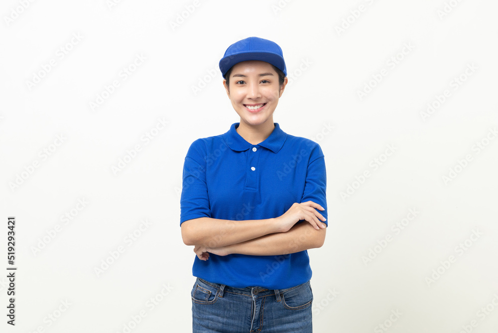 Happy delivery asian woman in blue uniform standing on isolated white background. Smiling female delivery service worker. Happy delivery asian woman in blue uniform standing on isolated white background. Smiling female delivery service worker.