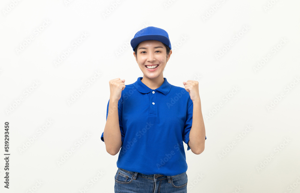 Happy delivery asian woman in blue uniform standing on isolated white background. Smiling female delivery service worker. Happy delivery asian woman in blue uniform standing on isolated white background. Smiling female delivery service worker.