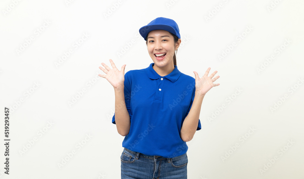 Happy delivery asian woman in blue uniform standing on isolated white background. Smiling female delivery service worker. Happy delivery asian woman in blue uniform standing on isolated white background. Smiling female delivery service worker.