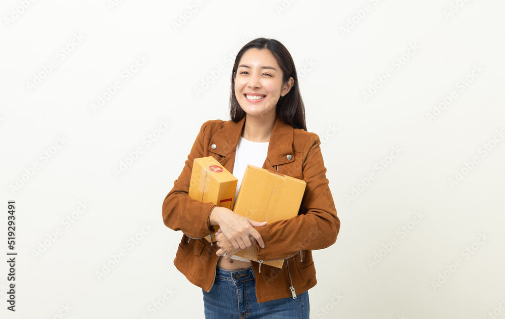 Young excited beautiful asian woman with many parcel cardboard standing on isolated white background. Cheerful female holding lot of parcel box receive from the delivery service Young excited beautiful asian woman with many parcel cardboard standing on isolated white background. Cheerful female holding lot of parcel box receive from the delivery service