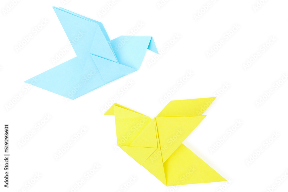 Blue and yellow paper birds isolated on white background Blue and yellow paper birds isolated on white background