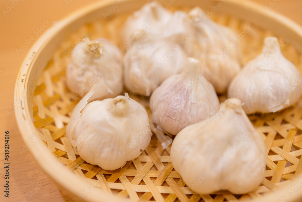 Stack of whole garlic on basket Stack of whole garlic on basket