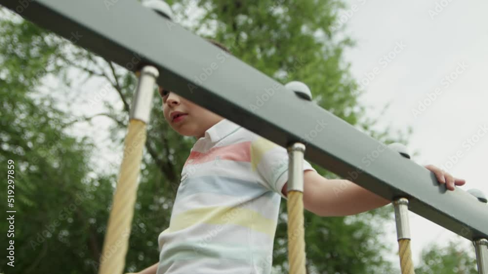 4K. A child on the playground in the park 4K. A child on the playground in the park