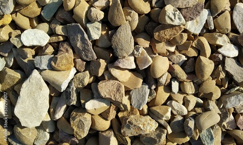 Abstract background with lot of various shape peeble stones.  photo