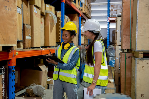 Manager supervisor dicuss with team visit store warehouse checking inventory goods in the shelf before distribute to factory 
 photo