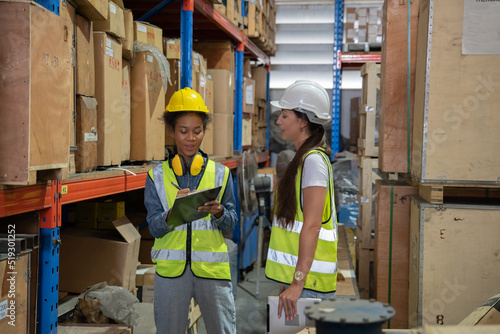 Manager supervisor dicuss with team visit store warehouse checking inventory goods in the shelf before distribute to factory 
 photo