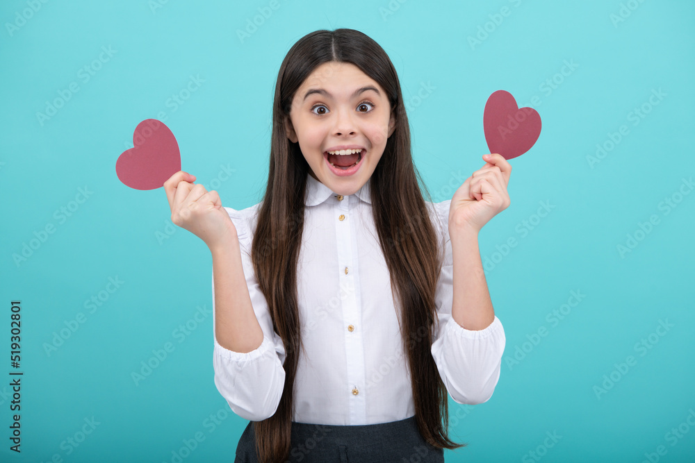 Lovely child girl 12, 13, 14 years old with shape heart love holiday and valentine symbol. Valentine or birthday day. Lovely child girl 12, 13, 14 years old with shape heart love holiday and valentine symbol. Valentine or birthday day.