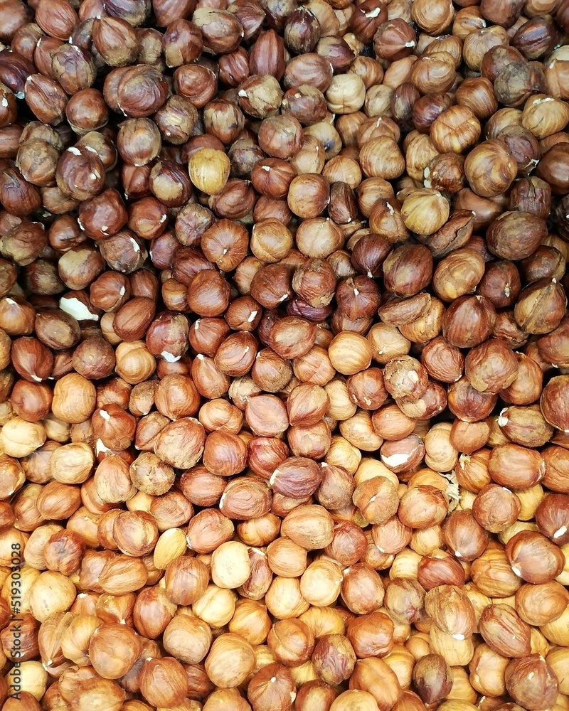 Hazelnuts. A lot of nuts are on the counter in the store. Hazelnuts. A lot of nuts are on the counter in the store.