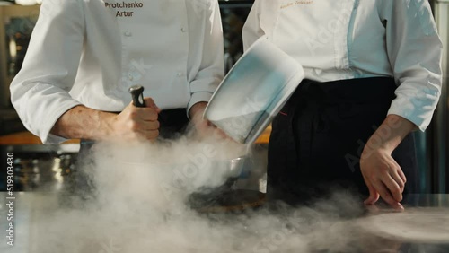 Professional kitchen: liquid nitrogen is added during the cooking of a molecular dish photo