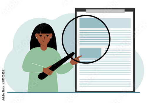 A woman holds a magnifying glass and examines a document, contract or agreement. The concept of a lawyer, businessman, or attorney at work.