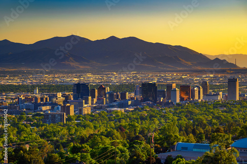 Salt Lake City skyline at sunset with Wasatch Mountains in the background, Utah photo