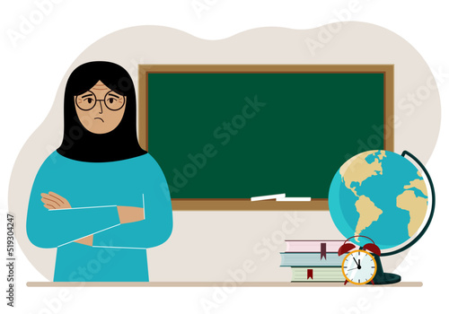 Female teacher near the blackboard. The concept of education, teaching, teacher's day.