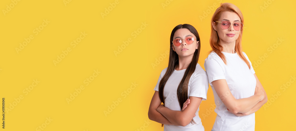 Mother and daughter child banner, copy space, isolated background. young girls in eyeglasses. portrait of happy child and mom. express positive emotions.
