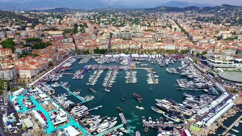 Vieux port - Cannes, France Aerial view of the beautiful port with yachts, surrounded by Mediterranean sea. 
Cannes Yachting Festival - September 2021 photo