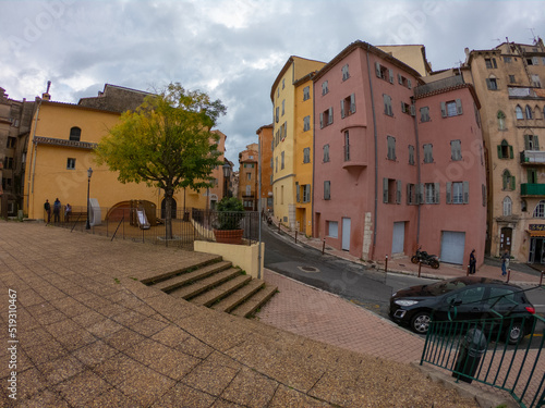 Grasse, France, October 3, 2021: The colorful facades of houses in the old heart of the perfume town of Grasse, southern France, French Riviera.