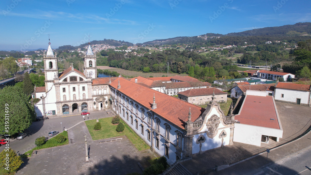 Santo Tirso, Portugal, April 16, 2022: Aerial view of the Abade Pedrosa Municipal Museum and the Monastery of St. Benedict (Sao Bento) in the city of Santo Tirso, with the Ave River in the background.