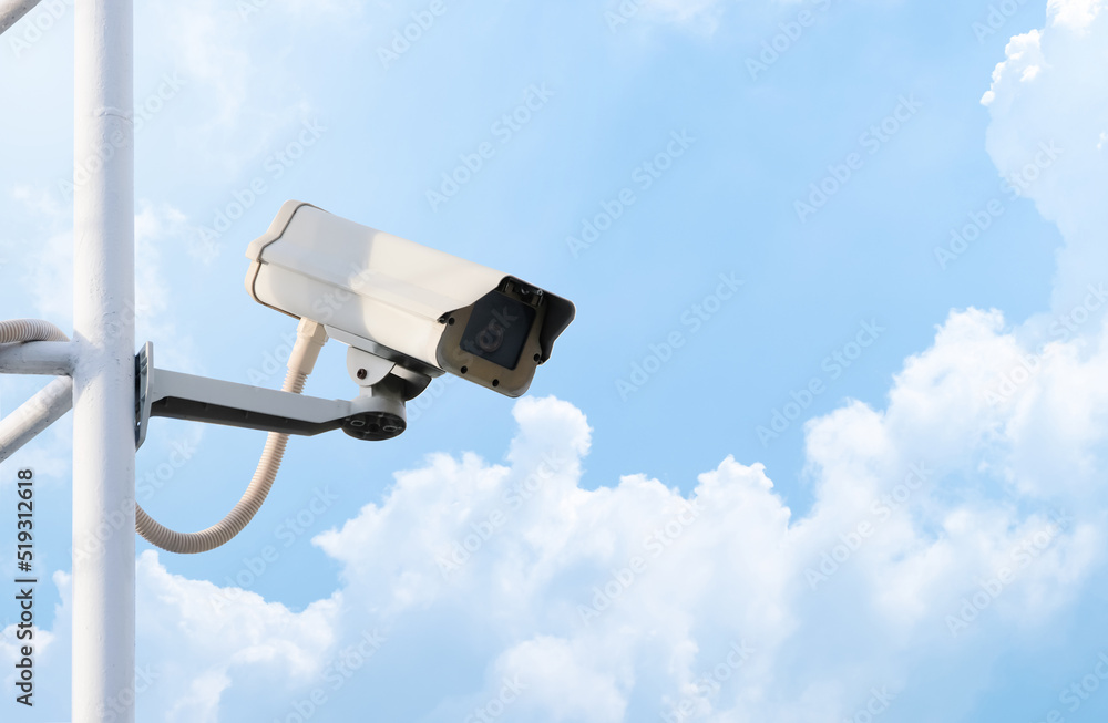 Modern public CCTV camera with clear sky background. Recording cameras for monitoring all day and night. Concept of surveillance and monitoring with copy space. Modern public CCTV camera with clear sky background. Recording cameras for monitoring all day and night. Concept of surveillance and monitoring with copy space.