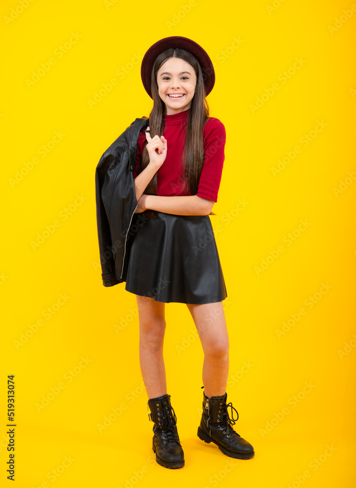 Full length of pretty cheerful teenager girl having fun good mood and posing in casual clothes isolated over yellow background. Happy teenager portrait. Smiling girl. Full length of pretty cheerful teenager girl having fun good mood and posing in casual clothes isolated over yellow background. Happy teenager portrait. Smiling girl.